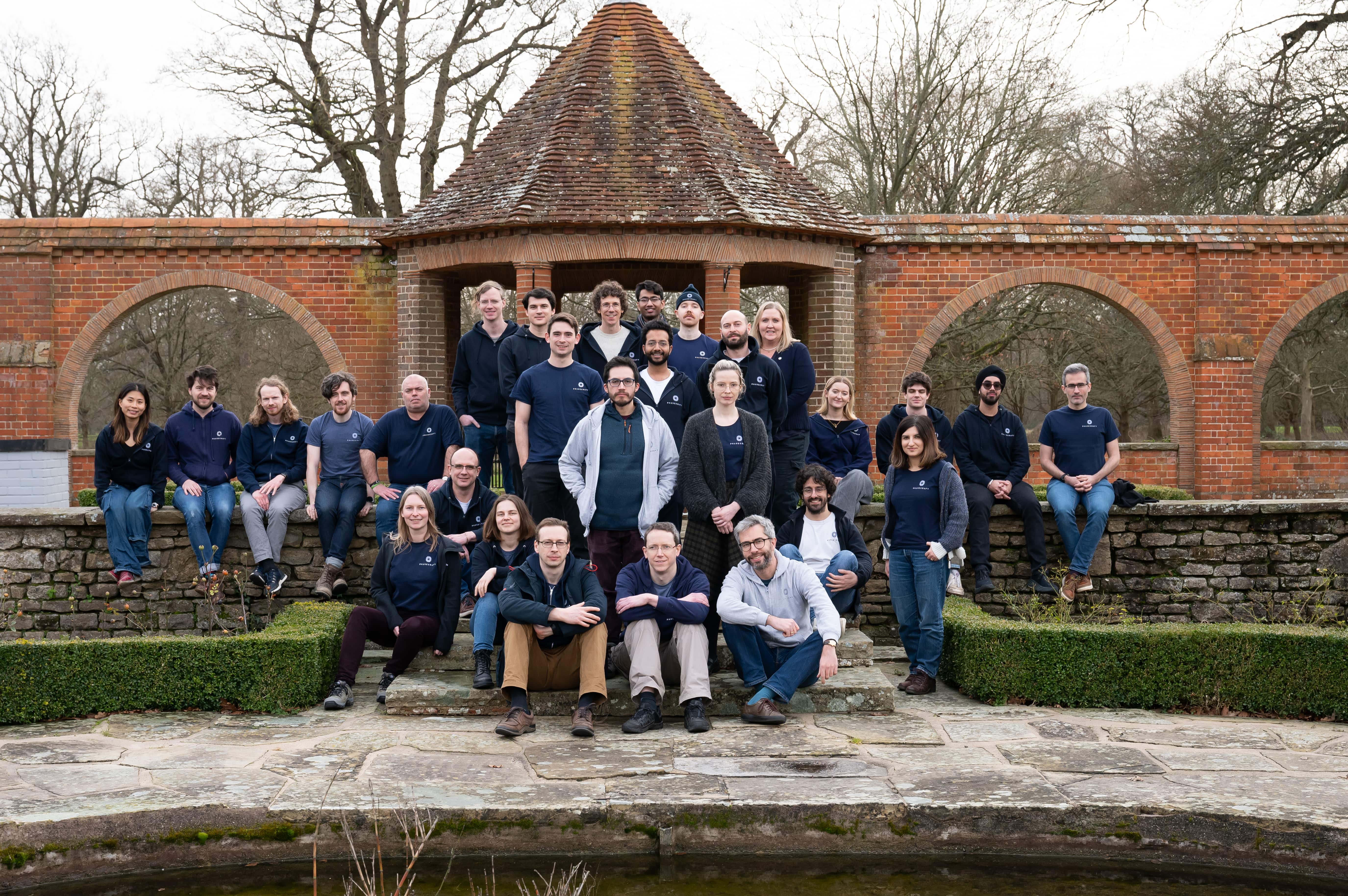 A group of staff who work for Phasecraft sitting in an outside area